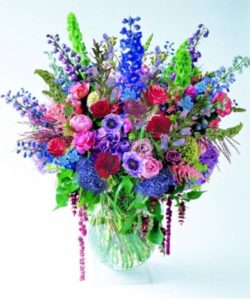 Very Very Large vase of all seasonal flowers in shades of blue, lavendars and pinks.